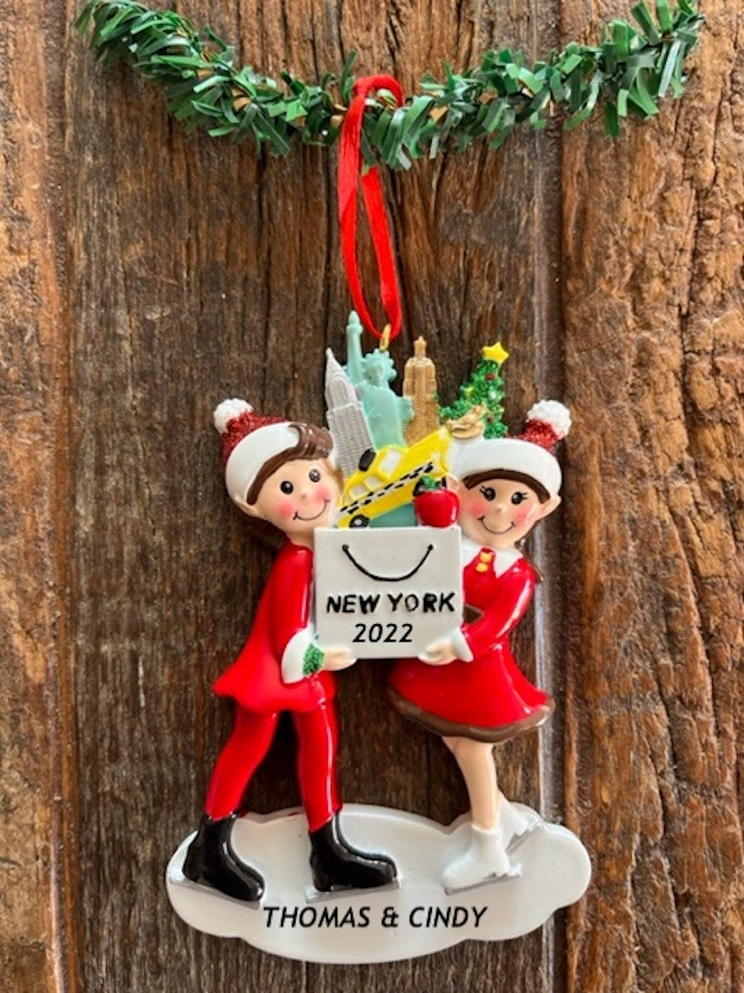 New York Skating Couple Holding Bag Filled With NYC Landmark Ornament Personalization